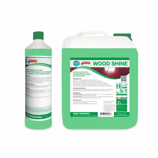 Abgebildet sind zwei grün-weiße Arcora WOOD SHINE Gebinde der Arcora International GmbH: eine 1-Liter-Flasche und ein 5-Liter-Kanister, beide mit deutscher Anleitung zur Reinigung von versiegelten Holz-, Parkett- und Laminatböden.