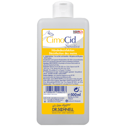Ένα μπουκάλι 500 ml Dr. Schnell CIMOCID SENSITIVE απολύμανσης χεριών από την DR.SCHNELL GmbH & Co. KGaA, με κίτρινη-λευκή ετικέτα στη γερμανική και γαλλική γλώσσα με πληροφορίες προϊόντος, γραμμωτό κώδικα, λογότυπο μάρκας και ένδειξη για την απαλή αλλά αποτελεσματική μείωση μικροβίων.