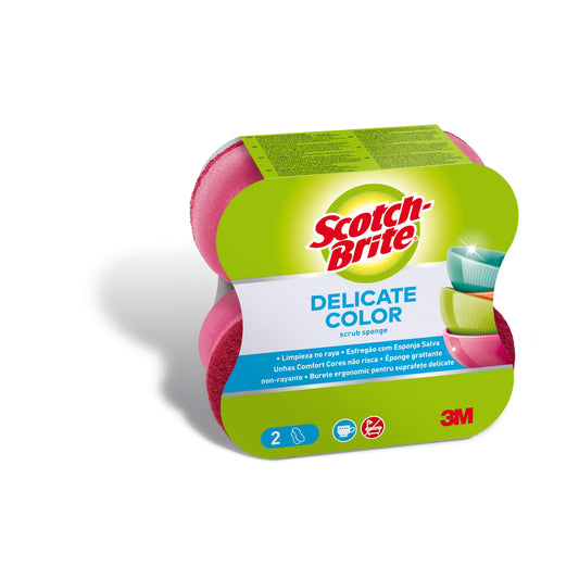 Eine Packung 3M Deutschland GmbH Scotch-Brite® Delicate Color Comfort kratzfreie Reinigungsschwämme, 2 Stück pro Packung, ist in einer grün-weißen Verpackung mit zwei rosa Schwämmen und bunten Schalen auf dem Etikett abgebildet.