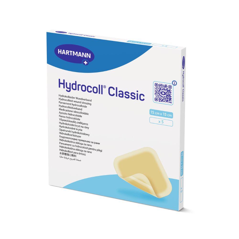 Ένα κουτί Hartmann Hydrocoll Classic Verband steril, 15x15 cm, 5 αποστειρωμένοι, σφραγισμένοι μεμονωμένα επίδεσμοι της Paul Hartmann AG. Υποστηρίζει υγρή περιποίηση τραυμάτων για κοκκιοποίηση/επιθηλιοποίηση· περιλαμβάνει πολυγλωσσική συσκευασία με εικόνα.