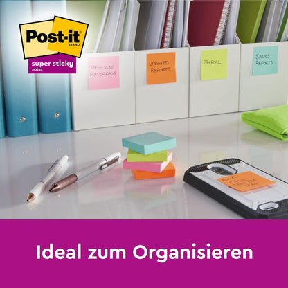 Ένα γραφείο με Post-it® Super Sticky Notes της 3M Deutschland GmbH (76 mm x 127 mm, 90 φύλλα/μπλοκ, 100% PEFC), που βοηθούν στην οργάνωση φακέλων όπως "Εξωτερικά υλικά", "Ενημερωμένες αναφορές", "Μισθοδοσία" και άλλα. Κείμενο: "Ιδανικό για οργάνωση."