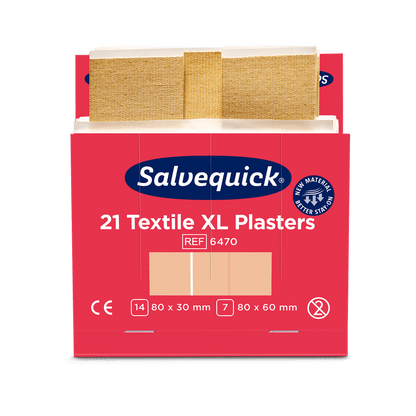 Ένα κόκκινο-λευκό κουτί με την επιγραφή "Orkla Wound Care AB Xl textilgips, 21 κομμάτια/ορυχείο | Πακέτο (6 κομμάτια)" με δύο μπεζ υφασμάτινα επιθέματα στις διαστάσεις 80 x 30 mm και 80 x 60 mm καθώς και πληροφορίες προϊόντος και πιστοποίησης.