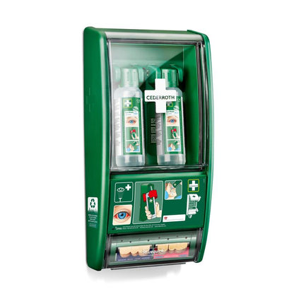 Ο σταθμός πλύσης ματιών Cederroth της Orkla Wound Care AB αποτελείται από δύο φιάλες των 500 ml (725200) και έναν διανομέα επιδέσμων Salvequick (490700), που είναι όλα στερεωμένα πίσω από ένα διαφανές κάλυμμα στον τοίχο, στο οποίο είναι ορατές οι οδηγίες χρήσης και το εμπορικό σήμα.