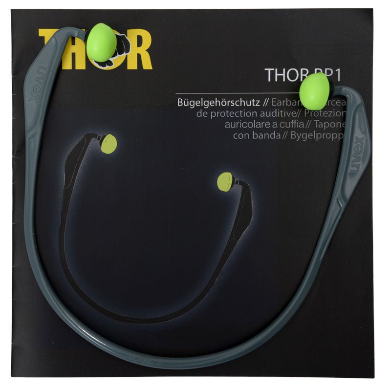 Ένα ζευγάρι γκρι ωτοασπίδες Abena Re-Seller GmbH Thor (812010) με πράσινες αφρώδεις άκρες αναπαύεται σε πολυγλωσσική συσκευασία με την επιγραφή "Συσκευασία (15 τεμάχια)".
