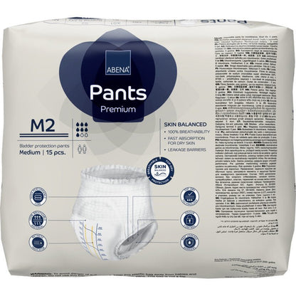 Μια συσκευασία με 15 ABENA Pants Premium M από την Abena Re-Seller GmbH, μεσαίου μεγέθους εσώρουχα μιας χρήσης με υψηλή απορροφητικότητα. Στη συσκευασία απεικονίζονται λεπτομέρειες προϊόντος, εικονίδια και εικόνες σε πολλές γλώσσες.