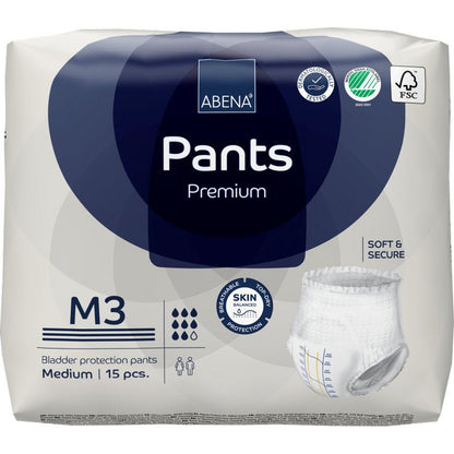 Μια συσκευασία ABENA Pants Premium M από την Abena Re-Seller GmbH, μεσαίου μεγέθους, 15 τεμάχια. Η συσκευασία τονίζει την προστασία του δέρματος, την απαλότητα, την ασφάλεια και την φιλική προς το περιβάλλον πιστοποίηση. Περιέχει μια εικόνα του εσώρουχου μιας χρήσης.
