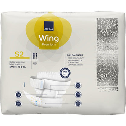 Μια συσκευασία 15 τεμαχίων ABENA Wing Premium της Abena Re-Seller GmbH στο μέγεθος Small έχει μια κυρίως λευκή συσκευασία με κίτρινες πινελιές, πληροφορίες προϊόντος, το κείμενο "Προστασία και Άνεση" και μια εικόνα προϊόντος στο μπροστινό μέρος.
