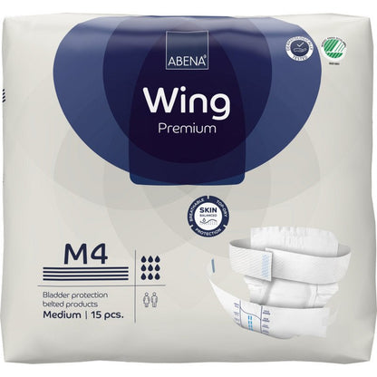 Μια συσκευασία ABENA Wing Premium από την Abena Re-Seller GmbH (μεσαίο, 15 τεμάχια) με συσκευασία που προσφέρει προστασία και άνεση, εικόνες προϊόντων, λογότυπο μάρκας και σύμβολα για απορρόφηση και προστασία δέρματος.