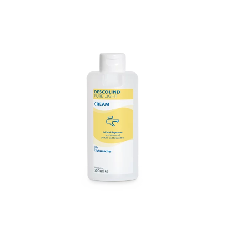 Eine weiße 500-ml-Plastikflasche der Dr. Schumacher GmbH Descolind Pure Light Cream Pflegecreme, parfümfrei für empfindliche Haut, hat ein gelbes Etikett mit blauer Schrift und ist vor einem schlichten weißen Hintergrund fotografiert.