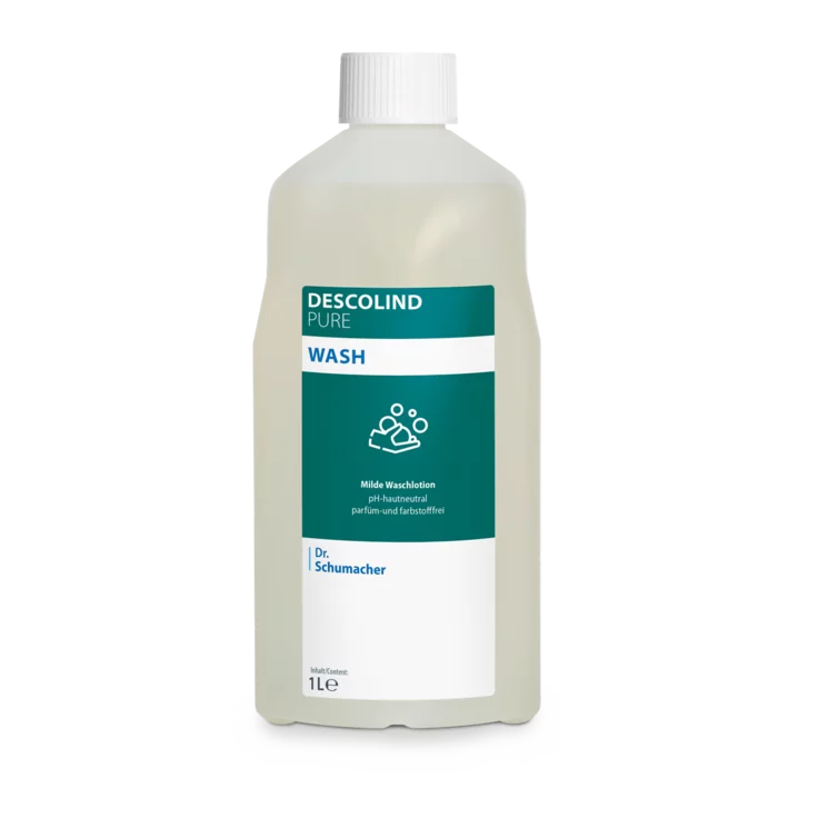 Dr. Schumacher Descolind Pure Wash Waschlotion της Dr. Schumacher GmbH σε ένα πλαστικό μπουκάλι 1 λίτρου, ουδέτερο pH και χωρίς άρωμα για ευαίσθητο δέρμα, με λευκό καπάκι και πράσινο-λευκή ετικέτα με πληροφορίες προϊόντος και σύμβολο πλυσίματος χεριών.