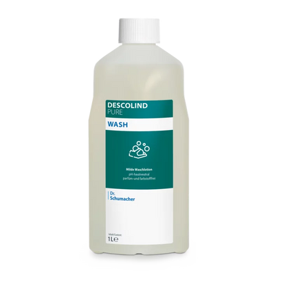 Dr. Schumacher Descolind Pure Wash Waschlotion της Dr. Schumacher GmbH σε ένα πλαστικό μπουκάλι 1 λίτρου, ουδέτερο pH και χωρίς άρωμα για ευαίσθητο δέρμα, με λευκό καπάκι και πράσινο-λευκή ετικέτα με πληροφορίες προϊόντος και σύμβολο πλυσίματος χεριών.