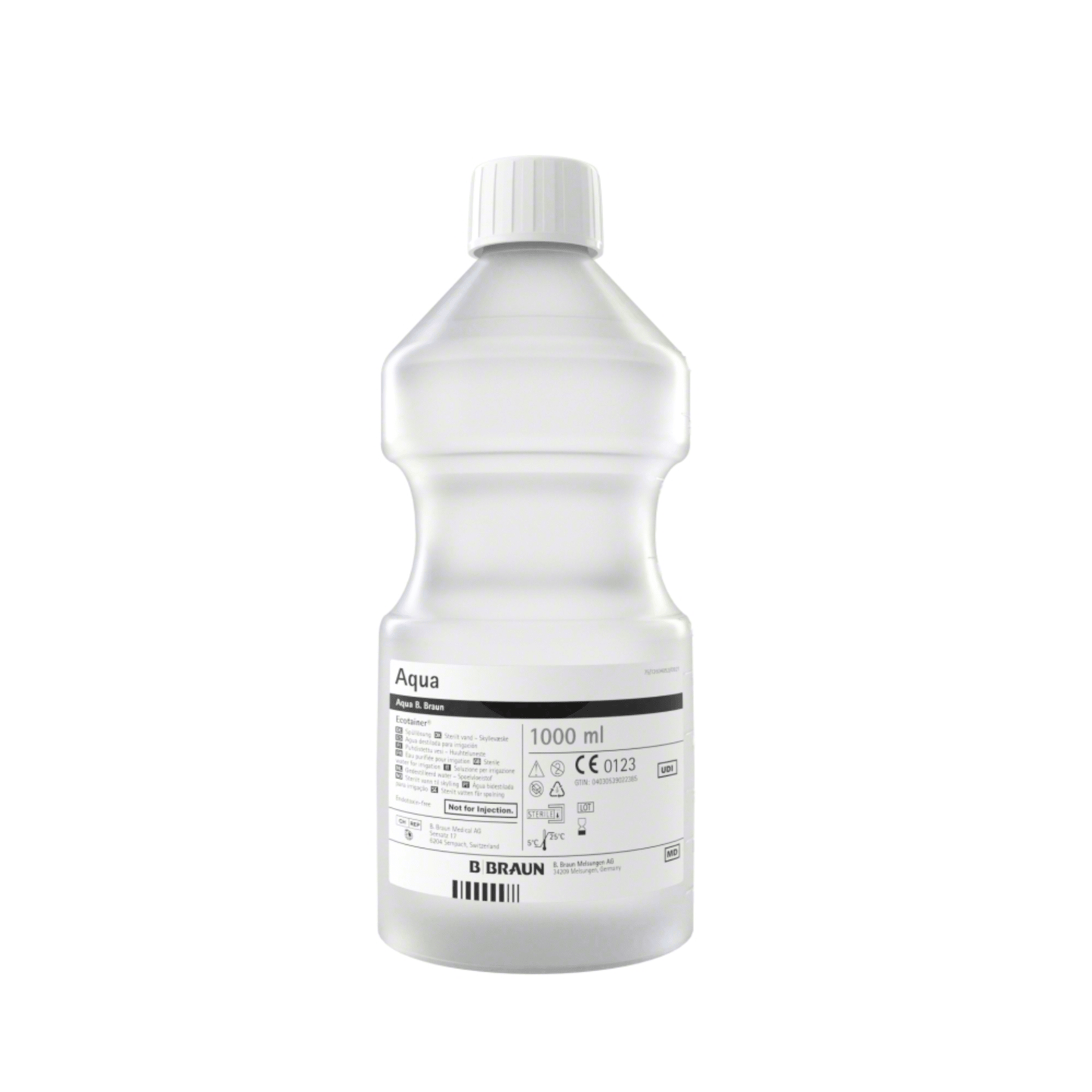 Το B. Braun Aqua Ecotainer® Τοπικό Διάλυμα Ξεπλύματος, ένα διαφανές πλαστικό μπουκάλι με χωρητικότητα 1000 ml, αποτελείται από φιλικό προς το περιβάλλον πολυπροπυλένιο. Διαθέτει λευκό καπάκι και είναι επισημασμένο με διάφορα σύμβολα και κείμενα, συμπεριλαμβανομένης της επωνυμίας B. Braun και οδηγιών για τη χρήση του τοπικού διαλύματος ξεπλύματος.