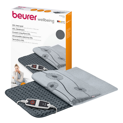 Απεικόνιση του Beurer HK 125 XXL-Heizkissen Cosy Grey Sets. Το γκρι θερμαινόμενο μαξιλάρι έχει μια βελούδινη επιφάνεια με απλό λουλουδάτο σχέδιο και διαθέτει ηλεκτρονικό ρυθμιστή με 6 ρυθμίσεις θερμοκρασίας. Στη συσκευασία εμφανίζεται το όνομα της μάρκας «Beurer GmbH» και λεπτομέρειες προϊόντος σε πολλές γλώσσες, πιστοποιημένο κατά OEKO-TEX® STANDARD 100.