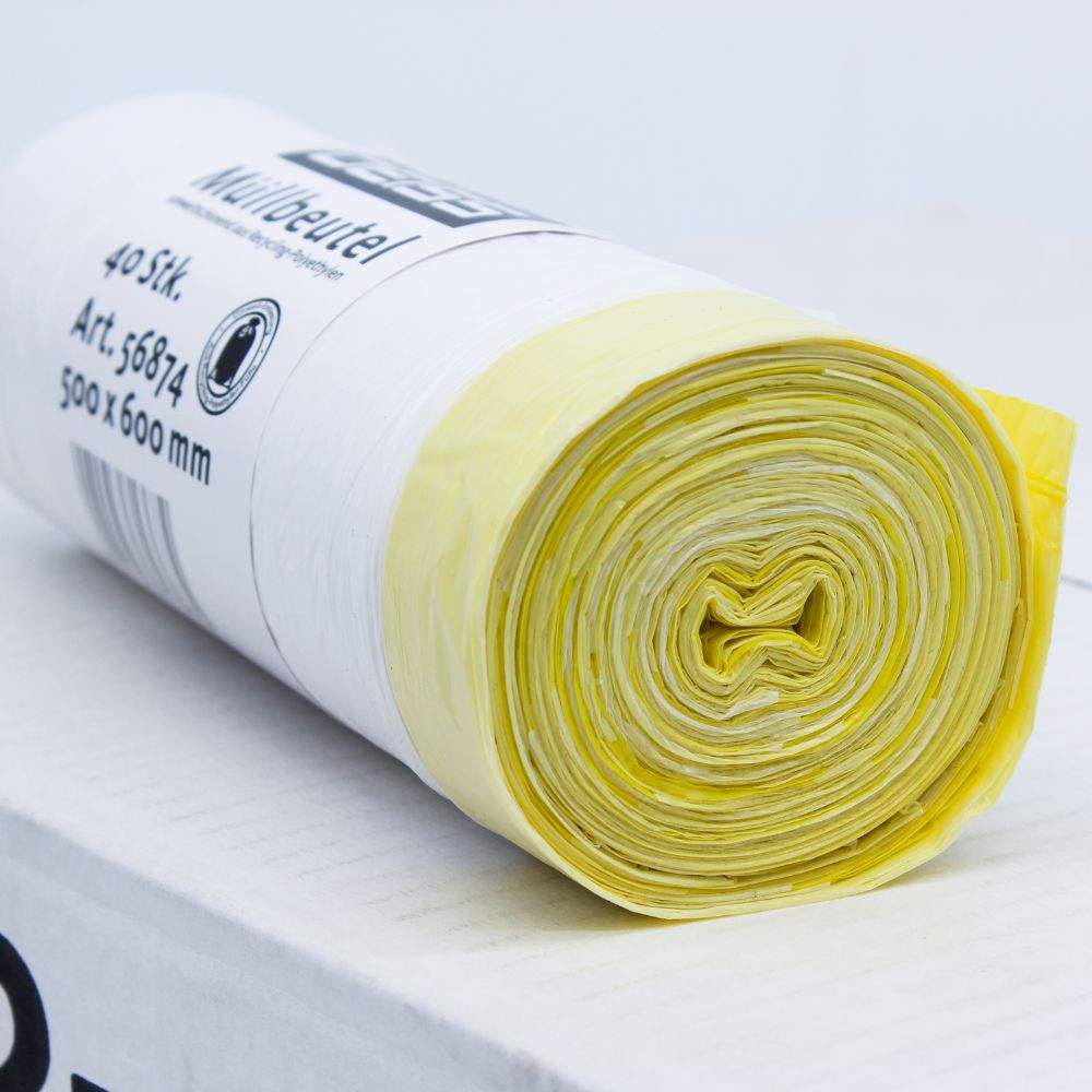 Ένα τυλιγμένο πακέτο DEISS Müllbeutel 56874 30 λίτρων με κορδόνι από την EMIL DEISS KG (GmbH + Co.), με κίτρινες και λευκές πλαστικές σακούλες απορριμμάτων σε λευκό φόντο. Η ετικέτα στο ρολό αναφέρει τις διαστάσεις 500 x 600 mm και δηλώνει ότι περιέχει 40 τεμάχια με χωρητικότητα 30 λίτρων το καθένα.