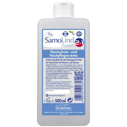Ένα μπουκάλι 500 ml Dr. Schnell SamoLind Sensitive 2in1 κρέμα προστασίας και περιποίησης δέρματος από την DR.SCHNELL GmbH & Co. KGaA με γερμανικό κείμενο, μπλε-λευκή ετικέτα, σύμβολα για vegan και ευαίσθητο δέρμα και εμπλουτισμένη με γλυκερίνη για πρόσθετη φροντίδα.