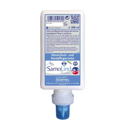 Ένα μπουκάλι 500 ml Dr. Schnell SamoLind Sensitive 2in1 κρέμα προστασίας και περιποίησης δέρματος από την DR.SCHNELL GmbH & Co. KGaA, με μπλε ακροφύσιο και μπροστινή ετικέτα με γερμανικές λεπτομέρειες προϊόντος.