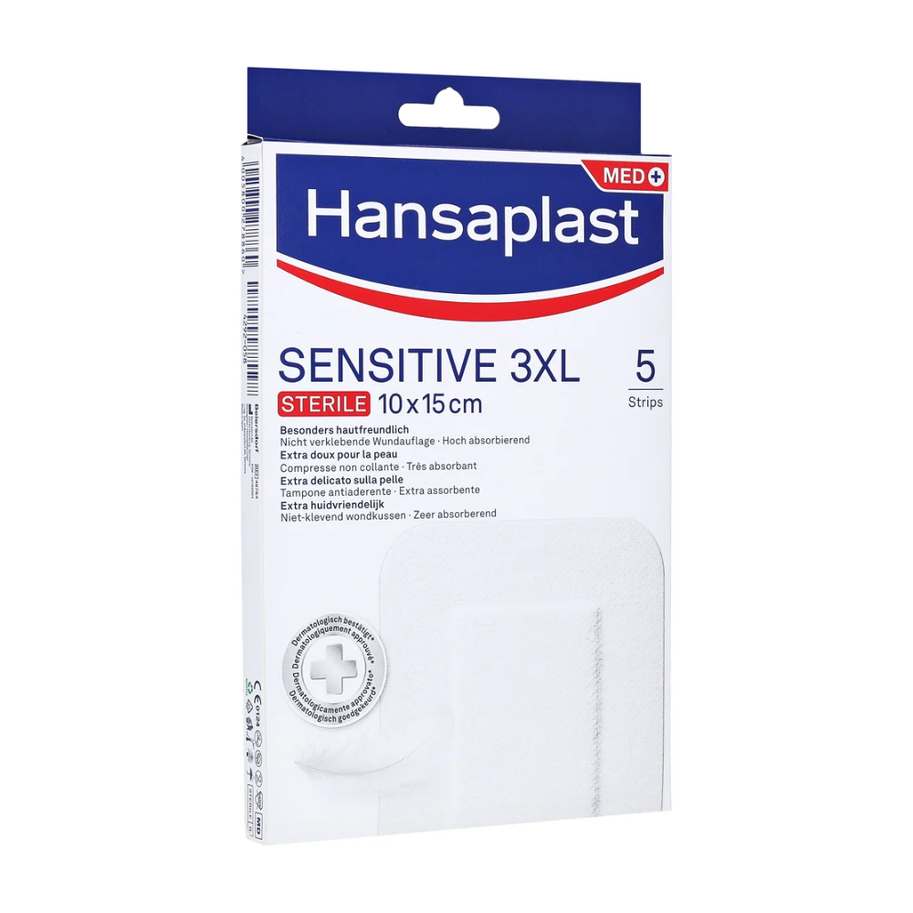 Μια συσκευασία με Hansaplast Sensitive XL, αποστειρωμένο, ιδιαίτερα φιλικό προς το δέρμα, αποστειρωμένες επιδέσμους της Beiersdorf AG με διαστάσεις 10 x 15 cm. Η συσκευασία περιέχει 5 επιδέσμους για φιλική προς το δέρμα και απορροφητική φροντίδα πληγών. Η κυρίως λευκή συσκευασία είναι διακοσμημένη με μπλε και κόκκινες λεπτομέρειες.