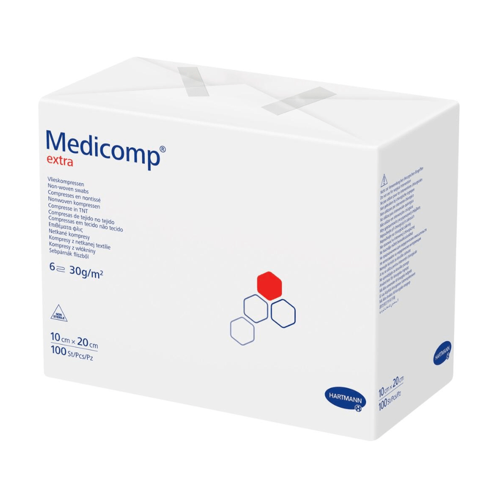 Ένα κουτί Hartmann Medicomp® extra μη αποστειρωμένη γάζα - 100 τεμάχια της Paul Hartmann AG, με κείμενο και λογότυπα κυρίως σε μπλε και κόκκινο σε λευκό φόντο. Στο κουτί αναφέρονται μεγέθη και ποσότητες.