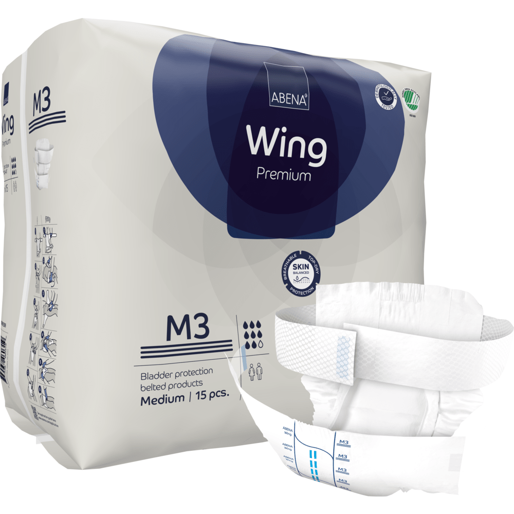 Μια συσκευασία ABENA Wing Premium ενηλίκων από την Abena Re-Seller GmbH, μέγεθος M3, περιέχει 15 κομμάτια. Μια πάνα απεικονίζεται μπροστά για να τονίσει το σχεδιασμό της και τις λωρίδες για άριστη προστασία και άνεση. Η συσκευασία δείχνει πληροφορίες προϊόντος και μάρκας.