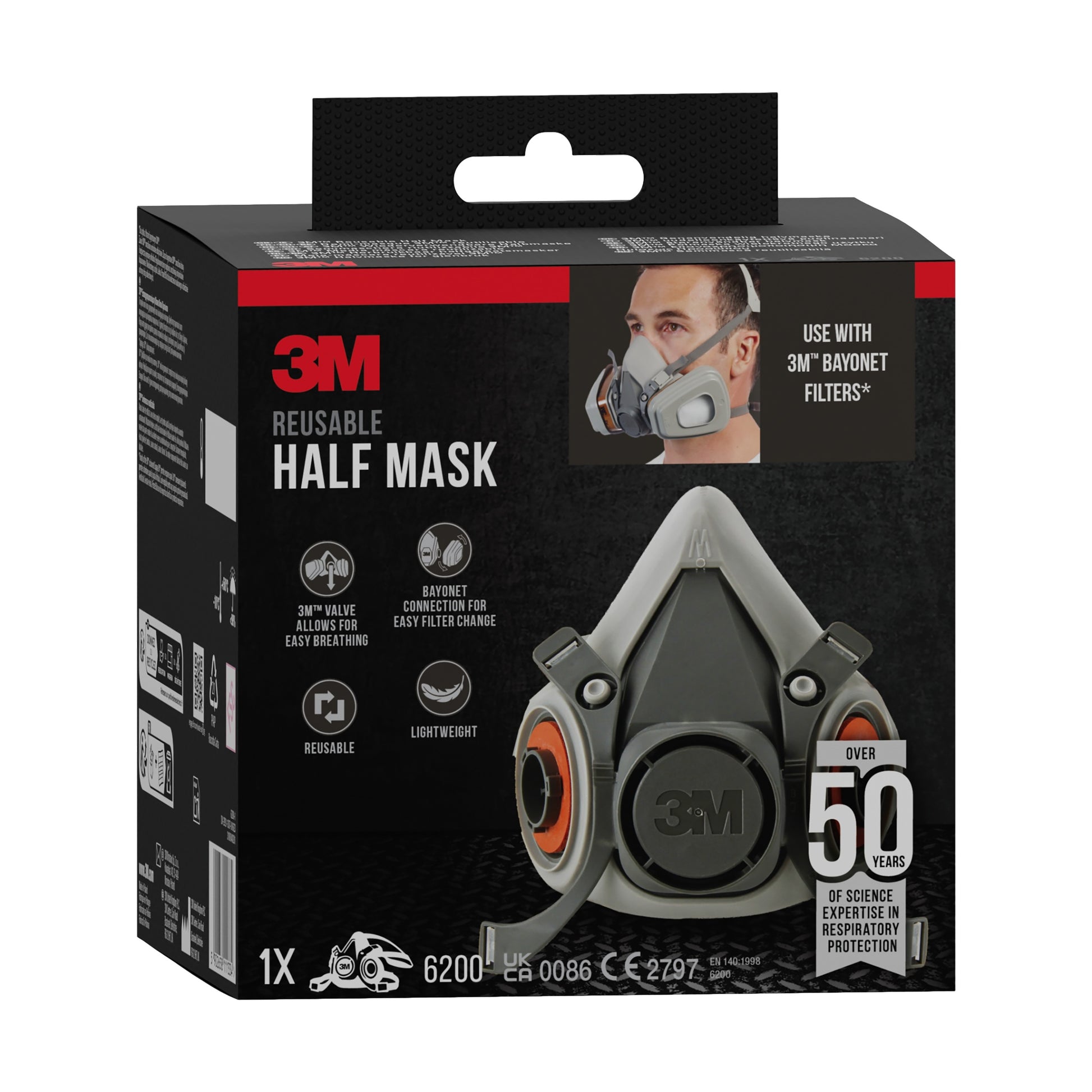 Die Verpackung des 3M™ Halbmasken-Gehäuses 6200 (mittelgroß) von 3M Deutschland GmbH zeigt die Maske, eine Person mit Halbmaske und Produktdetails wie Bayonettfilter-Kompatibilität und leichtes Design.