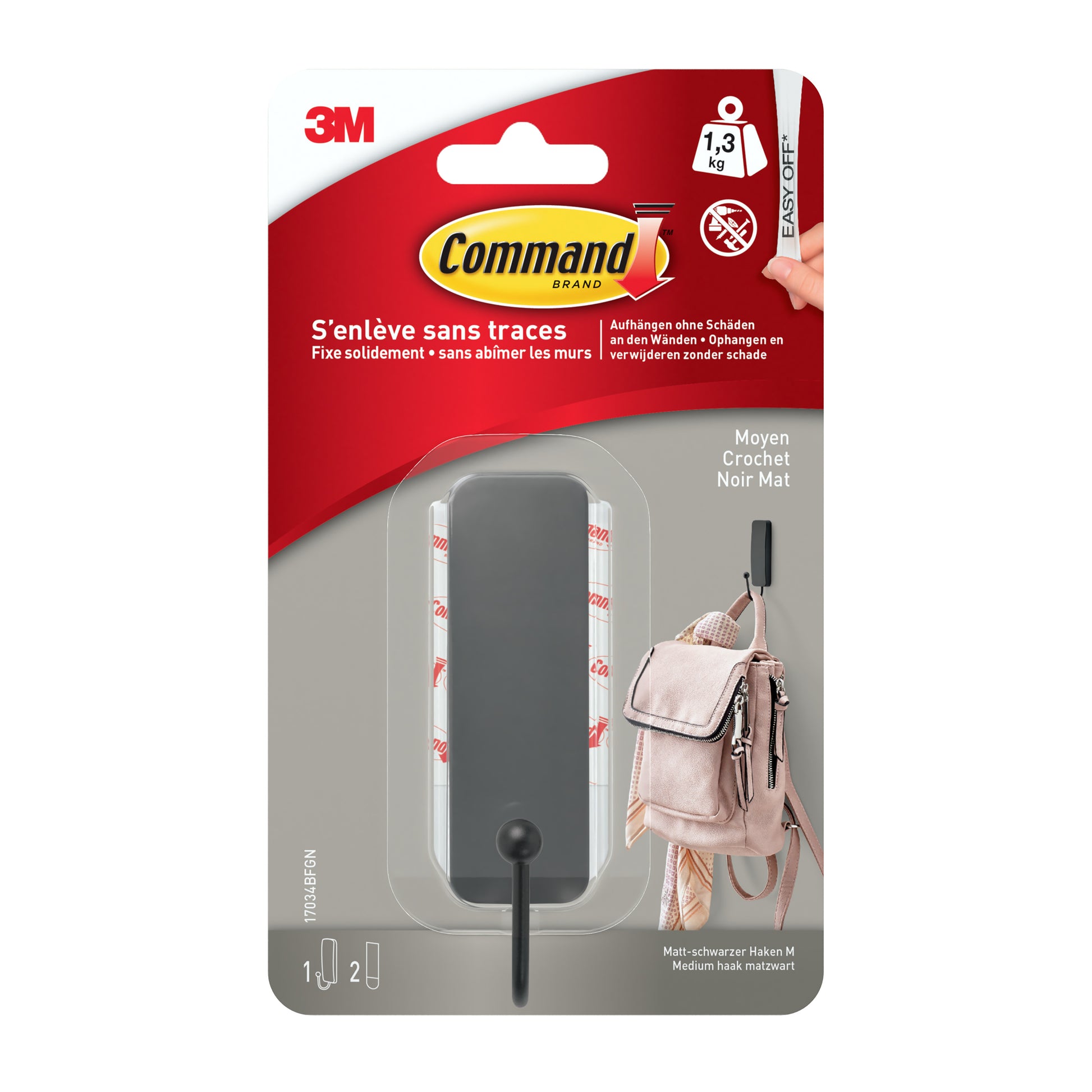 Eine Packung mit 1 mittelgroßer Command™ mattschwarzer Haken, 17034B, und 2 Strips von 3M Deutschland GmbH, abgebildet mit einem Rucksack-Ideal als Wandhaken ohne Bohren. Inklusive zweisprachigem Text und Branding.